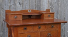 Detail upper drawers, corbel supported shelf and heart shaped cut out design.
